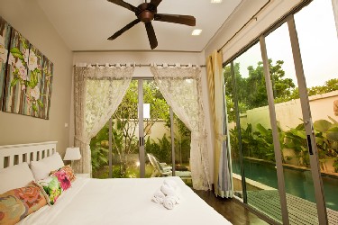 Second Bedroom with View to the Garden, Terrace and the Pool